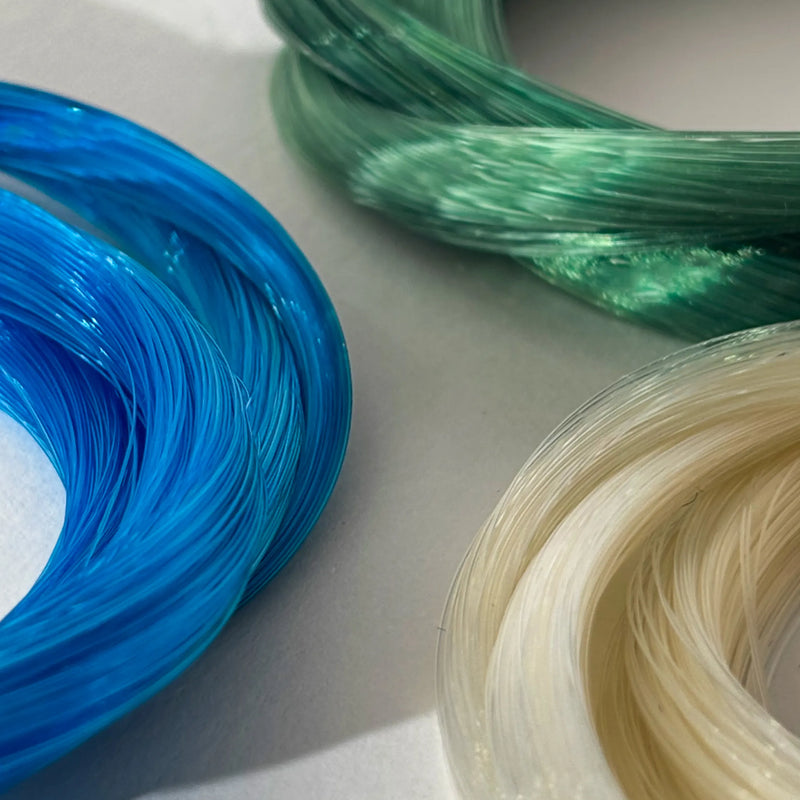 Blue and green Coruss bow hair