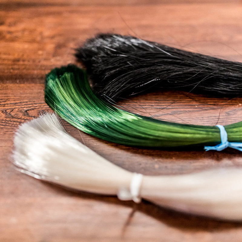 Coruss bow hair at the workbench
